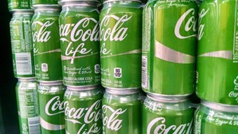 cans of cola coloured green